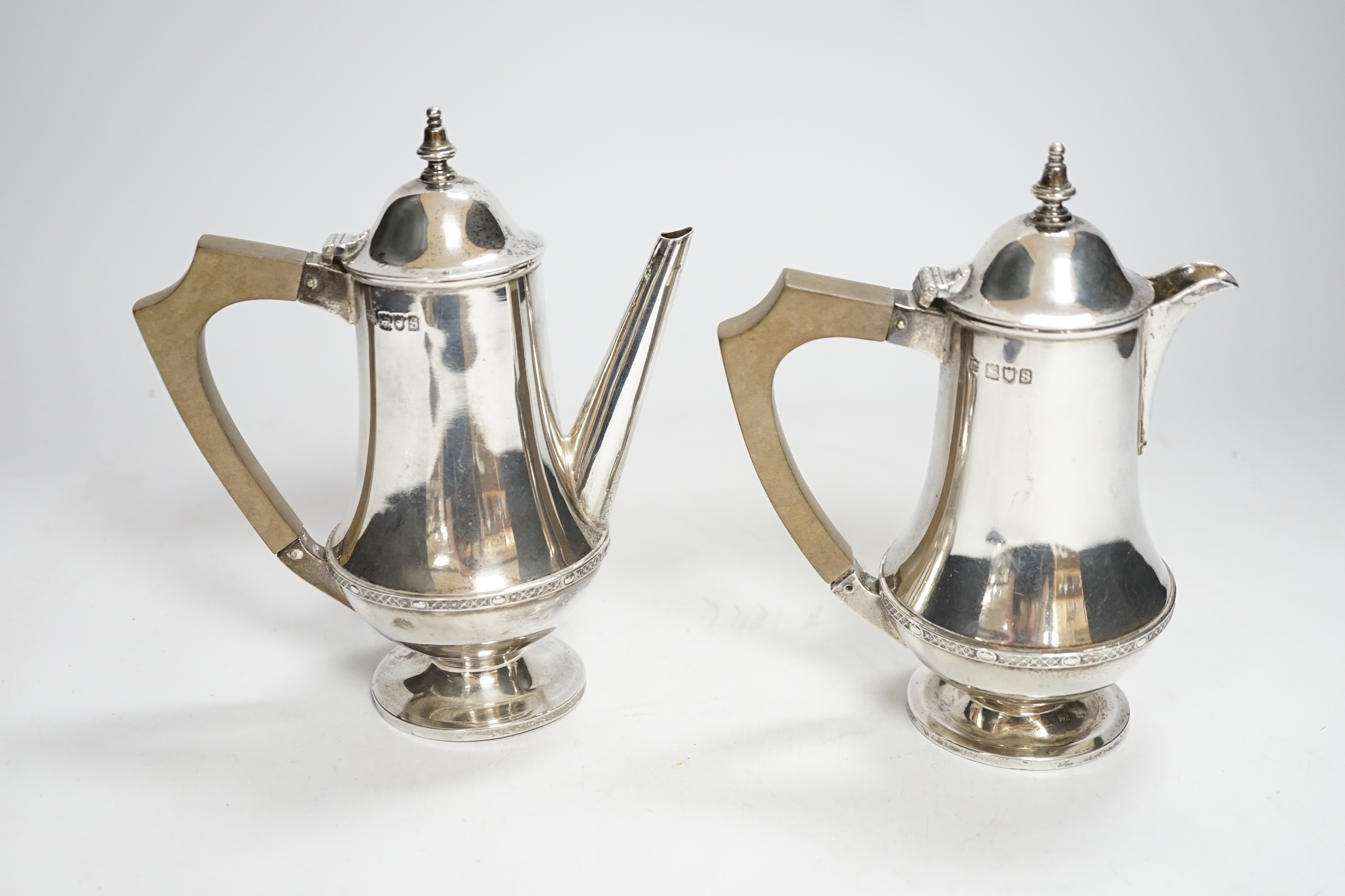 A George V silver bachelors café au lait pair, SW Smith & Co, London, 1913, 16.9cm, gross weight 15.7oz.